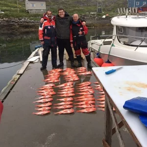 Rotbarsche und glückliche Fischer.